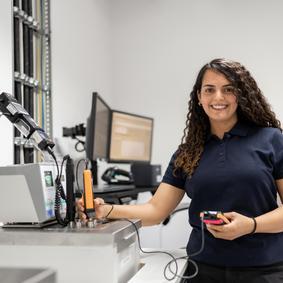 Calibration of thermodynamic measuring equipment A woman calibrates an immersion sensor used to measure temperature